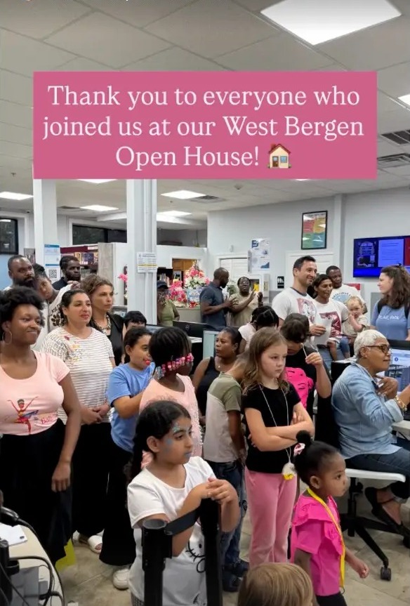 An Instagram Story posted by the Jersey City Free Public Library showing a large crowd of residents inside the West Bergen Branch, captioned 'Thank you to everyone who joined us at our West Bergen Open House!'