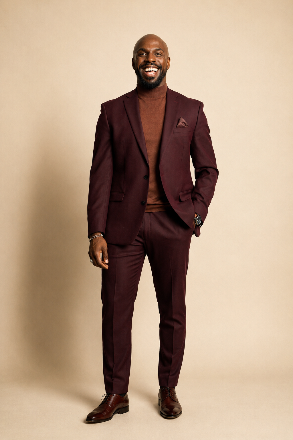 Elisha Dorsey, founder of Dorsey Design Studio, laughing in a burgundy suit